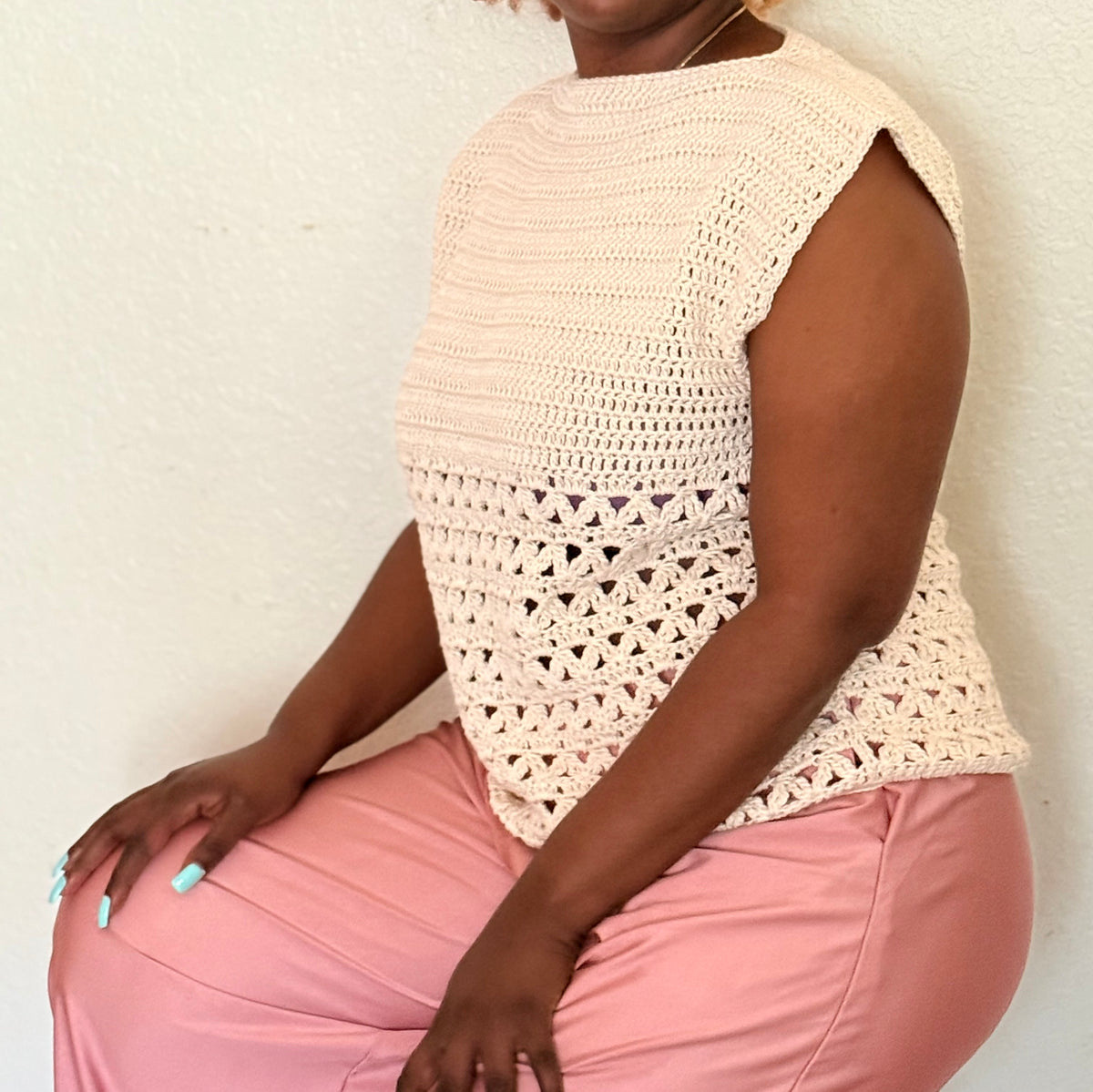 Side view of Arcelle cream crochet top showing open geometric lower section